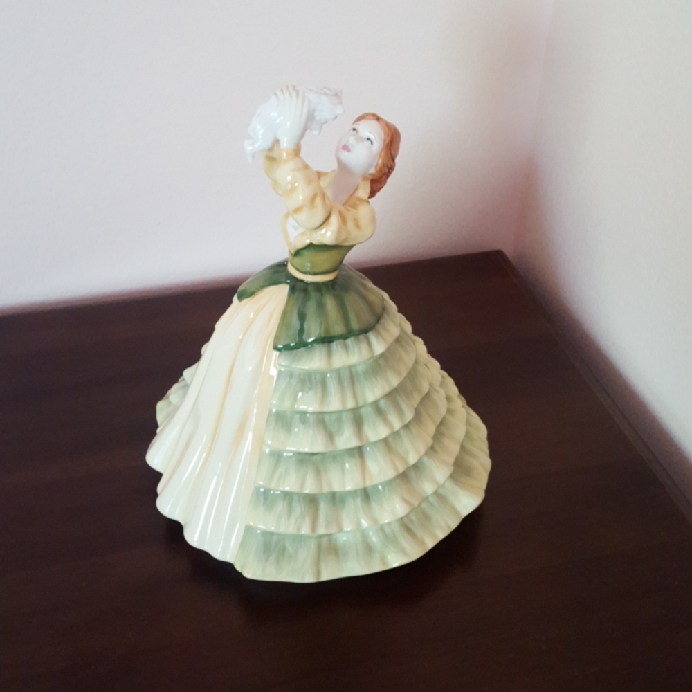 Royal Doulton Woman Holding a Dog Figurine